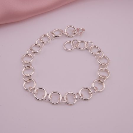 Hochglanzpoliertes Silber-Gliederarmband aus Sterling Silber mit S-Haken-Verschluss in 10 mm Breite.